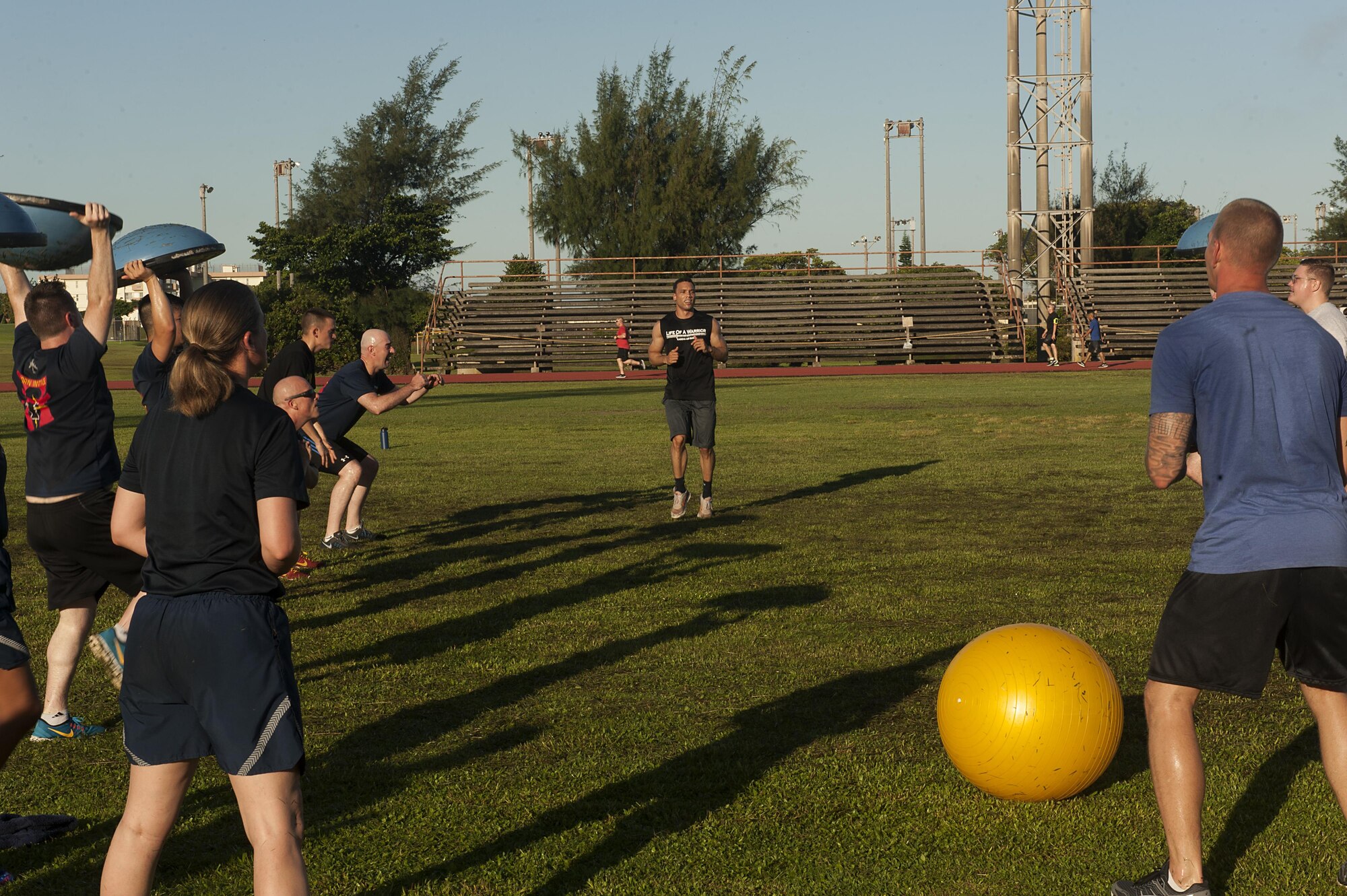 U.S. Air Force 1st Lt. Jonathon McKnight, 718th Civil Engineering Squadron OIC requirements & optimization officer leads a workout station at a Warrior Training Fitness workout June 28, 2017, at the Risner Fitness and Sports Complex, Kadena Air Base, Japan. McKnight and other leaders volunteered to help run the fitness program, and motivated attendees to push through the each high-intensity exercise station. (U.S. Air Force photo/Airman 1st Class Greg Erwin)