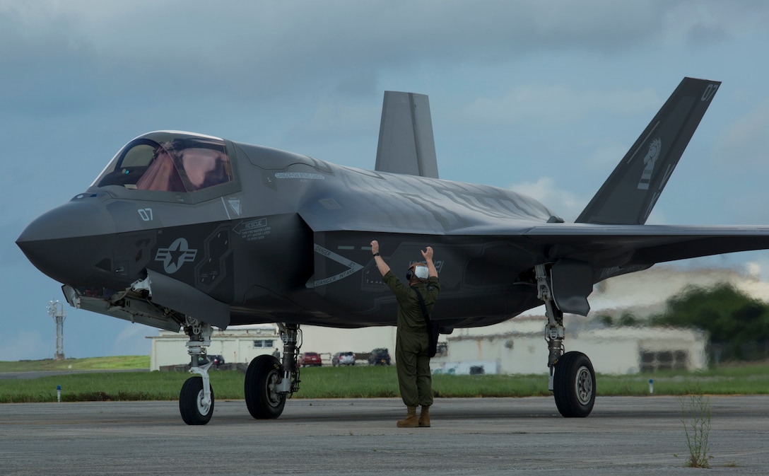 U.S. Marine Corps F-35B Lightning II aircraft resupplies at a hot pit refuel on Kadena Air Force Base, Okinawa, Japan, June 27, 2017. The Marines are with Marine Fighter Attack Squadron 121, Marine Aircraft Group 36, 1st Marine Aircraft Wing. The Marines worked with Airmen from 18th Logistics and Readiness Squadron, 353 Special Operations Group, 18th Wing. The two-day exercise enabled the U.S. Air Force and Marine Corps to improve interoperability and develop tactics, techniques and procedures involving the new aircraft for future joint FARP operations throughout the Indo-Asia Pacific Theater. (U.S. Marine Corps photo by Lance Cpl. Deseree Kamm)