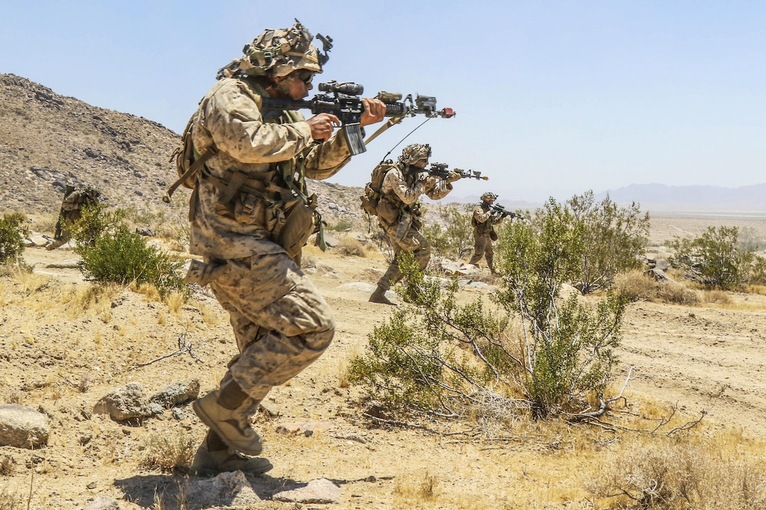 Marines maneuver along the National Training Center’s Brown Pass during a training exercise with soldiers at Fort Irwin, Calif., June 28, 2017. The Marines are assigned to Echo Company, 2nd Battalion, 4th Marine Regiment. Army photo by Pfc. Austin Anyzeski