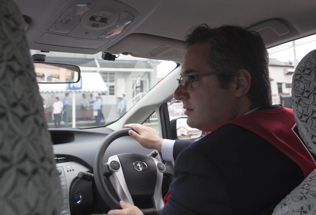 John Zambrano, a Marine Corps Air Station Iwakuni resident, drives around an instructional course during a free driving class held for station residents at Iwakuni City, Japan, June 28, 2017. The station residents learned traffic rules and manners and drove in a live course with Japanese instructors and translators. Twenty station residents were invited to take part in the short, educational workshop aimed to decrease the number of traffic accidents and violations caused by station residents. (U.S. Marine Corps photo by Lance Cpl. Carlos Jimenez)