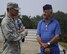 U.S. Air Force Maj. Jeric Talania, 8th Fighter Wing Protocol officer in charge, speaks with retired Buck Sgt. Richard Morse, Korean War veteran and former security forces patrolman, June 30, 2017, during a tour at Kunsan Air Base, Republic of Korea. Morse served at the former Kimpo Air Base, or K-14, in the Korean War, safeguarding F-86 Sabres during his enlistment. (U.S. Air Force photo by Staff Sgt. Victoria H. Taylor/Released)
