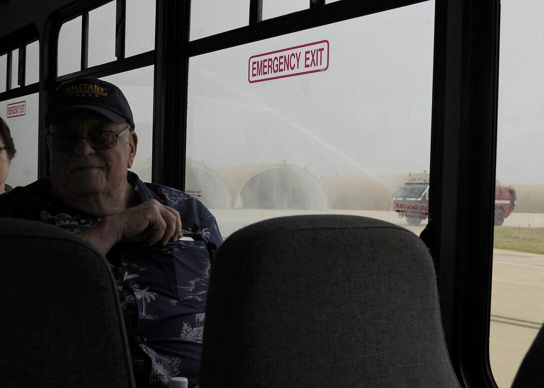 Retired U.S. Air Force Lt. Col. Roy Compton, 3rd Bomb Wing veteran and former B-26 navigator, receives a water salute June 30, 2017, during a tour at Kunsan Air Base, Republic of Korea. Compton served at Kunsan during the Korean War and flew more than 50 missions out of the air base from 1952 to 1953. (U.S. Air Force photo by Staff Sgt. Victoria H. Taylor/Released)