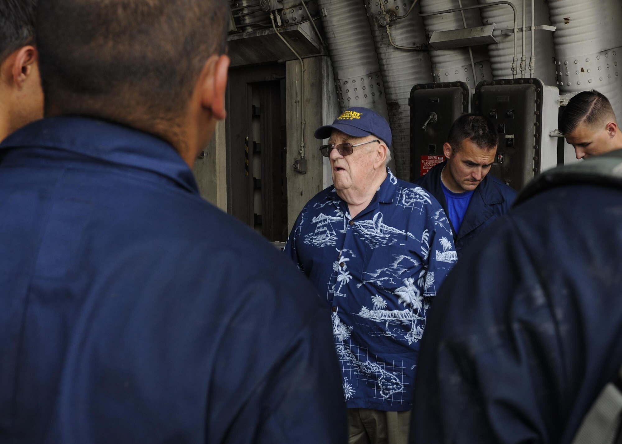 Retried U.S. Air Force Lt. Col. Roy Compton, 3rd Bomb Wing veteran and former B-26 navigator, speaks with Airmen assigned to the 8th Aircraft Maintenance Squadron June 30, 2017, during a tour at Kunsan Air Base, Republic of Korea. Compton served at Kunsan during the Korean War and flew more than 50 missions out of the air base from 1952 to 1953. (U.S. Air Force photo by Staff Sgt. Victoria H. Taylor/Released)
