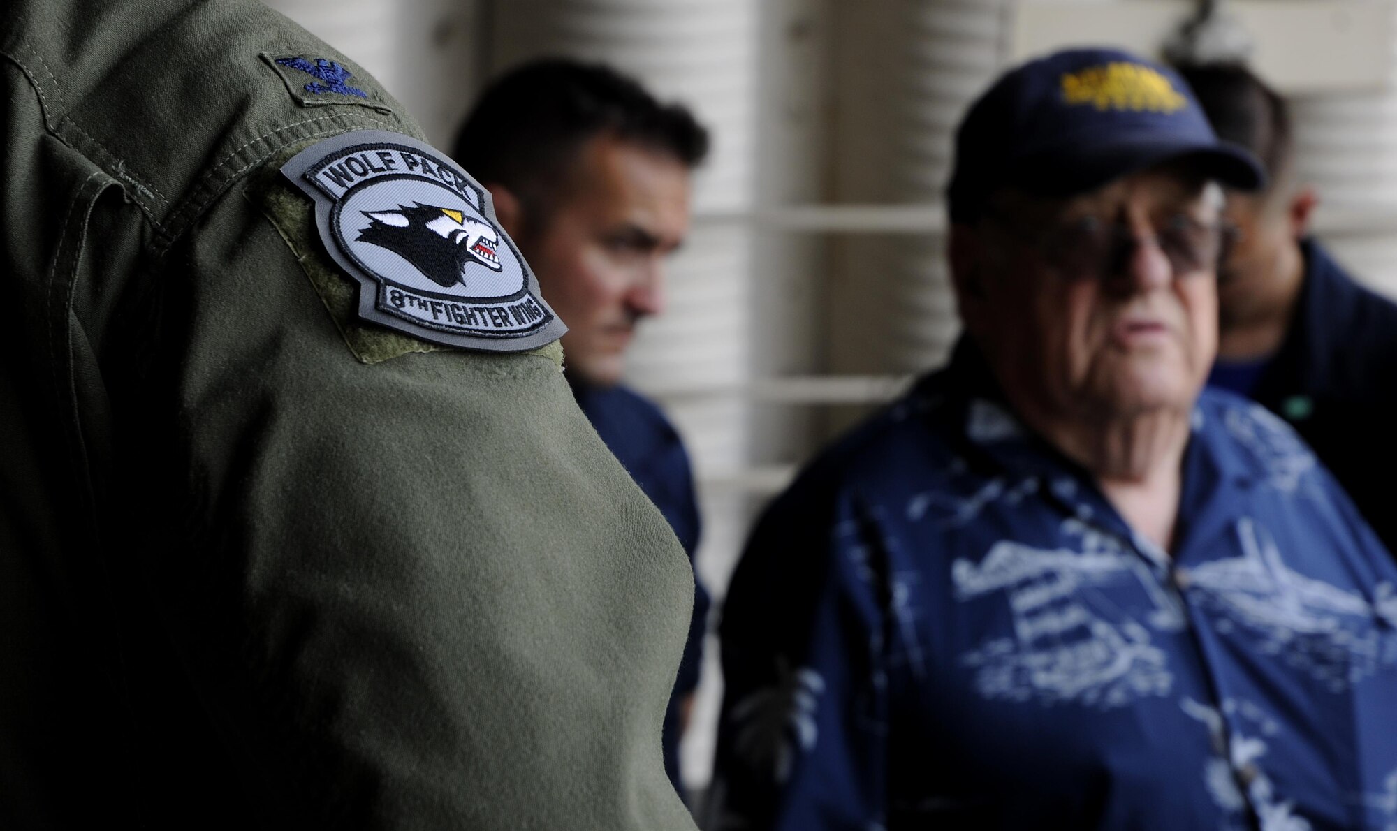 Retired U.S. Air Force Lt. Col. Roy Compton, 3rd Bomb Wing veteran and former B-26 navigator, speaks with Airmen June 30, 2017, during a tour at Kunsan Air Base, Republic of Korea. Compton served at Kunsan during the Korean War and flew more than 50 missions out of the air base from 1952 to 1953. (U.S. Air Force photo by Staff Sgt. Victoria H. Taylor/Released)