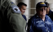 Retired U.S. Air Force Lt. Col. Roy Compton, 3rd Bomb Wing veteran and former B-26 navigator, speaks with Airmen June 30, 2017, during a tour at Kunsan Air Base, Republic of Korea. Compton served at Kunsan during the Korean War and flew more than 50 missions out of the air base from 1952 to 1953. (U.S. Air Force photo by Staff Sgt. Victoria H. Taylor/Released)