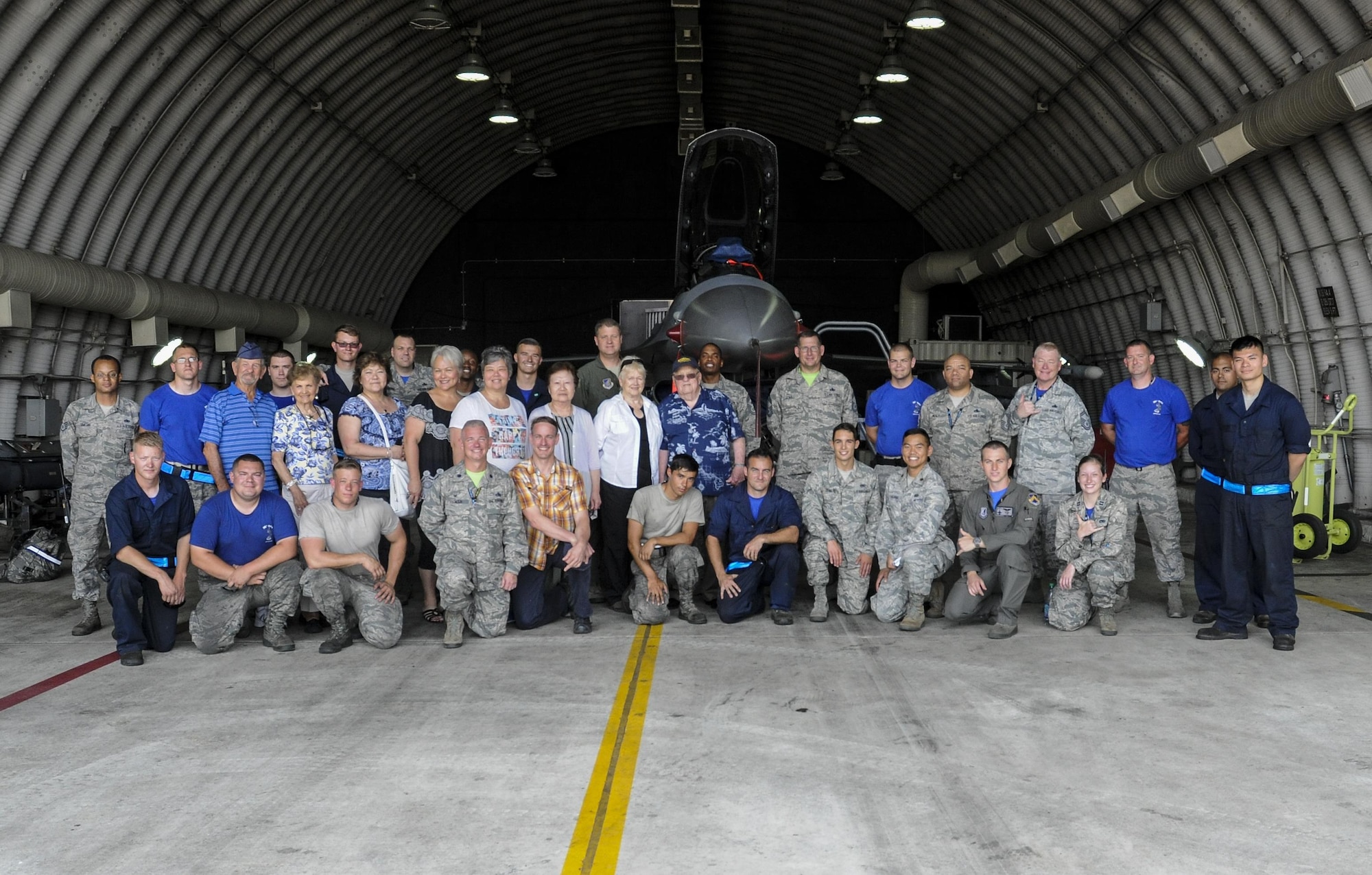 U.S. Air Force Airmen assigned to the 8th Aircraft Maintenance Squadron and Korean War veterans and their families pose for a photo June 30, 2017, during a tour at Kunsan Air Base, Republic of Korea. Members of the Korean War Veterans Association, which is comprised of veterans and their families, received the tour as a sign of thanks for the sacrifices they endured in order to make the Wolf Pack what it is today. (U.S. Air Force photo by Staff Sgt. Victoria H. Taylor/Released) (U.S. Air Force photo by Staff Sgt. Victoria H. Taylor/Released)