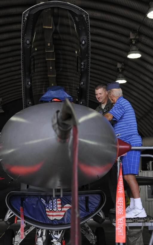 U.S. Air Force Col. David G. Shoemaker, 8th Fighter Wing commander, speaks to retired Buck Sgt. Richard Morse, Korean War veteran and former security forces patrolman, June 30, 2017, during a tour at Kunsan Air Base, Republic of Korea. Members on the tour visited the major landmarks on the installation while meeting Wolf Pack Airmen. (U.S. Air Force photo by Staff Sgt. Victoria H. Taylor/Released)