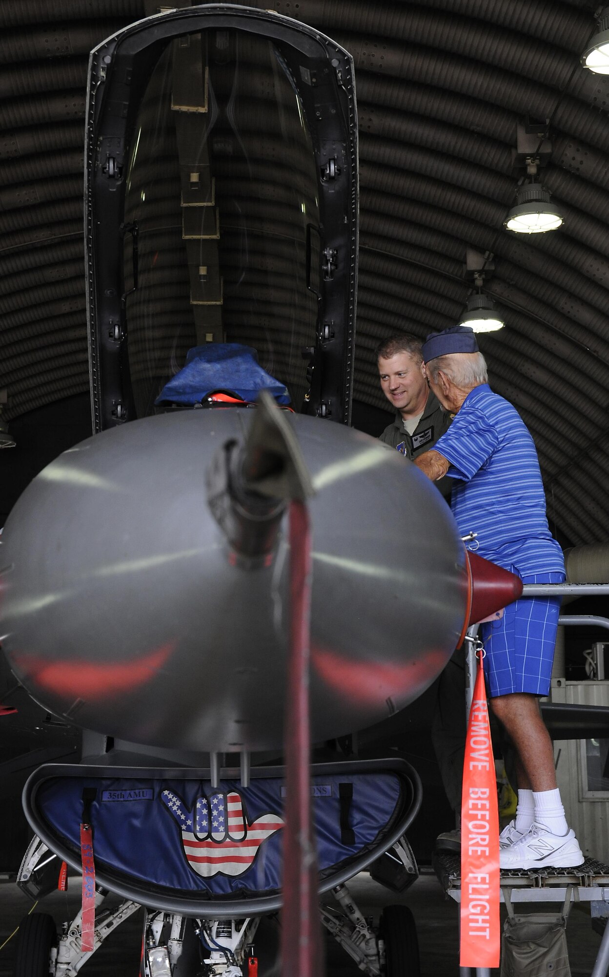 U.S. Air Force Col. David G. Shoemaker, 8th Fighter Wing commander, speaks to retired Buck Sgt. Richard Morse, Korean War veteran and former security forces patrolman, June 30, 2017, during a tour at Kunsan Air Base, Republic of Korea. Members on the tour visited the major landmarks on the installation while meeting Wolf Pack Airmen. (U.S. Air Force photo by Staff Sgt. Victoria H. Taylor/Released)