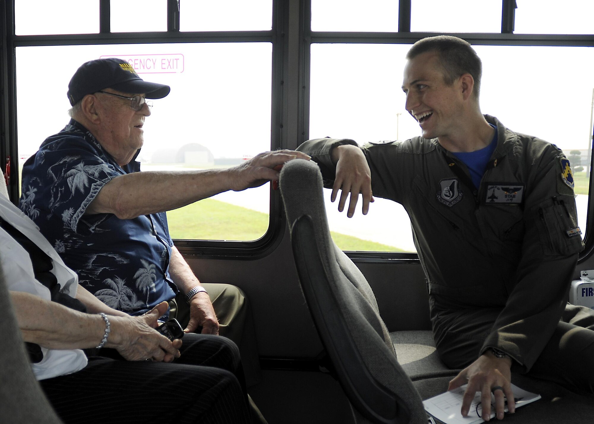 Retired U.S. Air Force Lt. Col. Roy Compton, 3rd Bomb Wing veteran and former B-26 navigator, speaks to Capt. Matt Schuetz, 35th Fighter Squadron B Flight  commander, June 30, 2017, during a tour at Kunsan Air Base, Republic of Korea. Compton served at Kunsan during the Korean War and flew more than 50 missions out of the air base from 1952 to 1953. (U.S. Air Force photo by Staff Sgt. Victoria H. Taylor/Released)