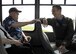 Retired U.S. Air Force Lt. Col. Roy Compton, 3rd Bomb Wing veteran and former B-26 navigator, speaks to Capt. Matt Schuetz, 35th Fighter Squadron B Flight  commander, June 30, 2017, during a tour at Kunsan Air Base, Republic of Korea. Compton served at Kunsan during the Korean War and flew more than 50 missions out of the air base from 1952 to 1953. (U.S. Air Force photo by Staff Sgt. Victoria H. Taylor/Released)