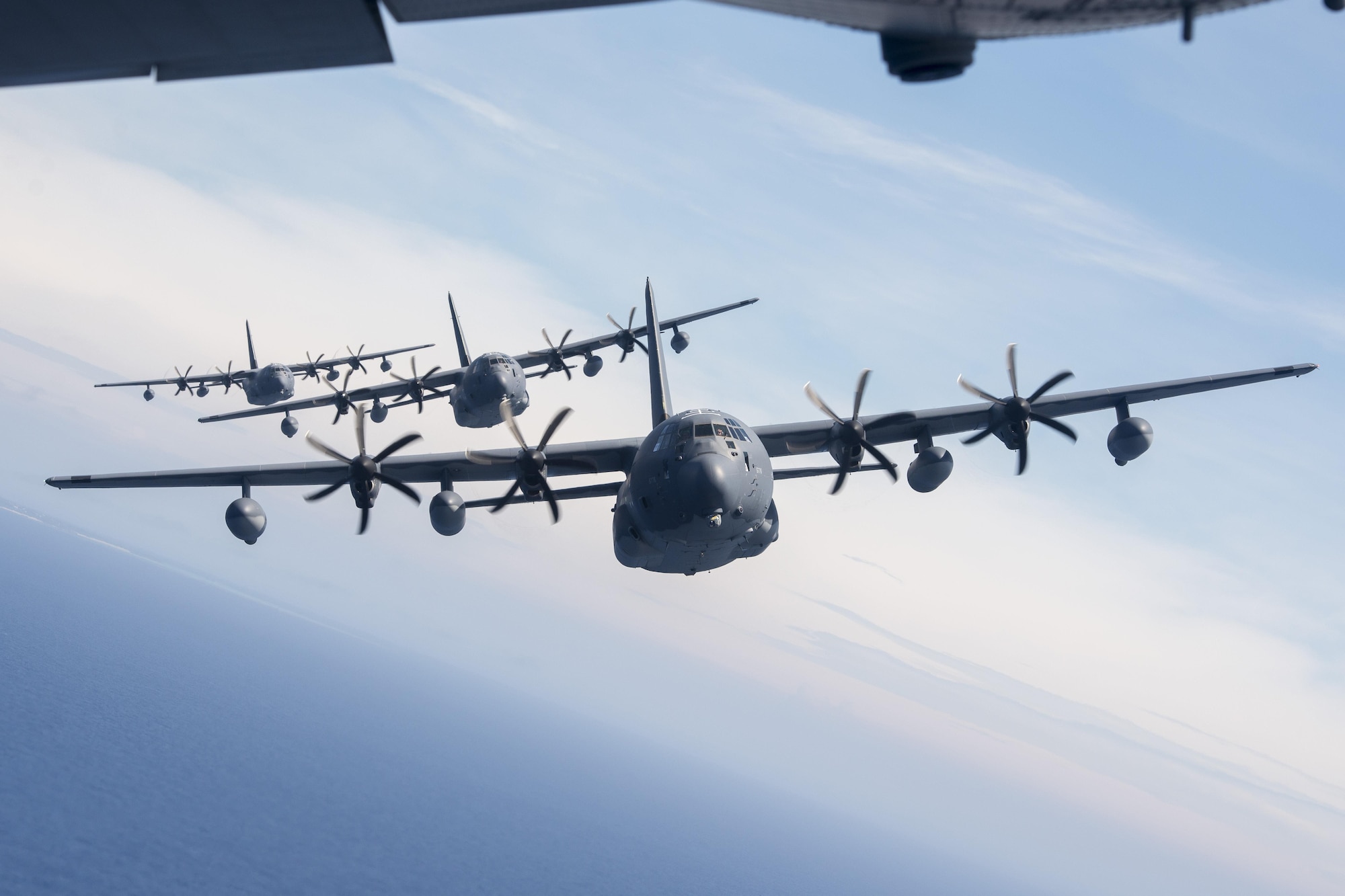 U.S. Air Force MC-130J Commando IIs from the 17th Special Operations Squadron line up in a five-aircraft formation June 22, 2017 off the coast of Okinawa, Japan, during a mass launch training mission. The MC-130J Commando II is a multi-mission combat transport/special operations tanker capable of delivering a payload of 42,000 pounds. (U.S. Air Force photo by Senior Airman John Linzmeier)