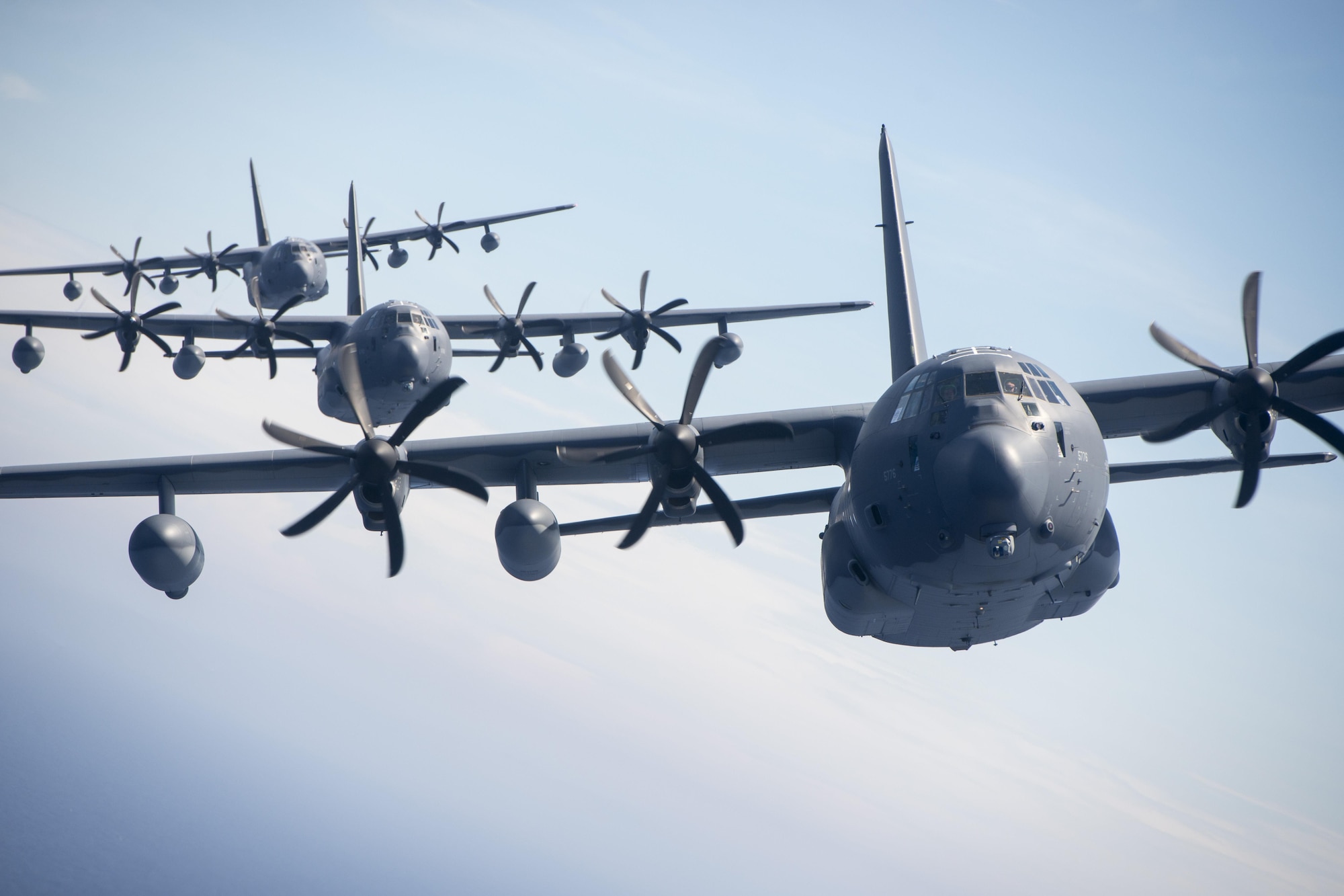 U.S. Air Force MC-130J Commando IIs from the 17th Special Operations Squadron line up in a five-aircraft formation during a mass launch training mission June 22, 2017 off the coast of Okinawa, Japan. Routine flights and airdrops are conducted to maintain proficiency and training certifications for prospective missions. (U.S. Air Force photo by Senior Airman John Linzmeier)