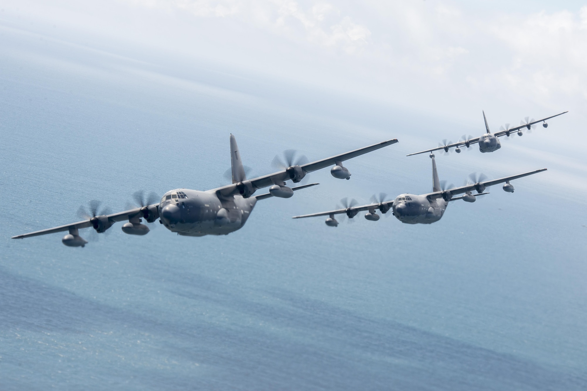 U.S. Air Force MC-130J Commando IIs from the 17th Special Operations Squadron line up in a five-aircraft formation during a mass launch training mission June 22, 2017 off the coast of Okinawa, Japan. Routine flights and airdrops are conducted to maintain proficiency and training certifications for prospective missions. (U.S. Air Force photo by Senior Airman John Linzmeier)