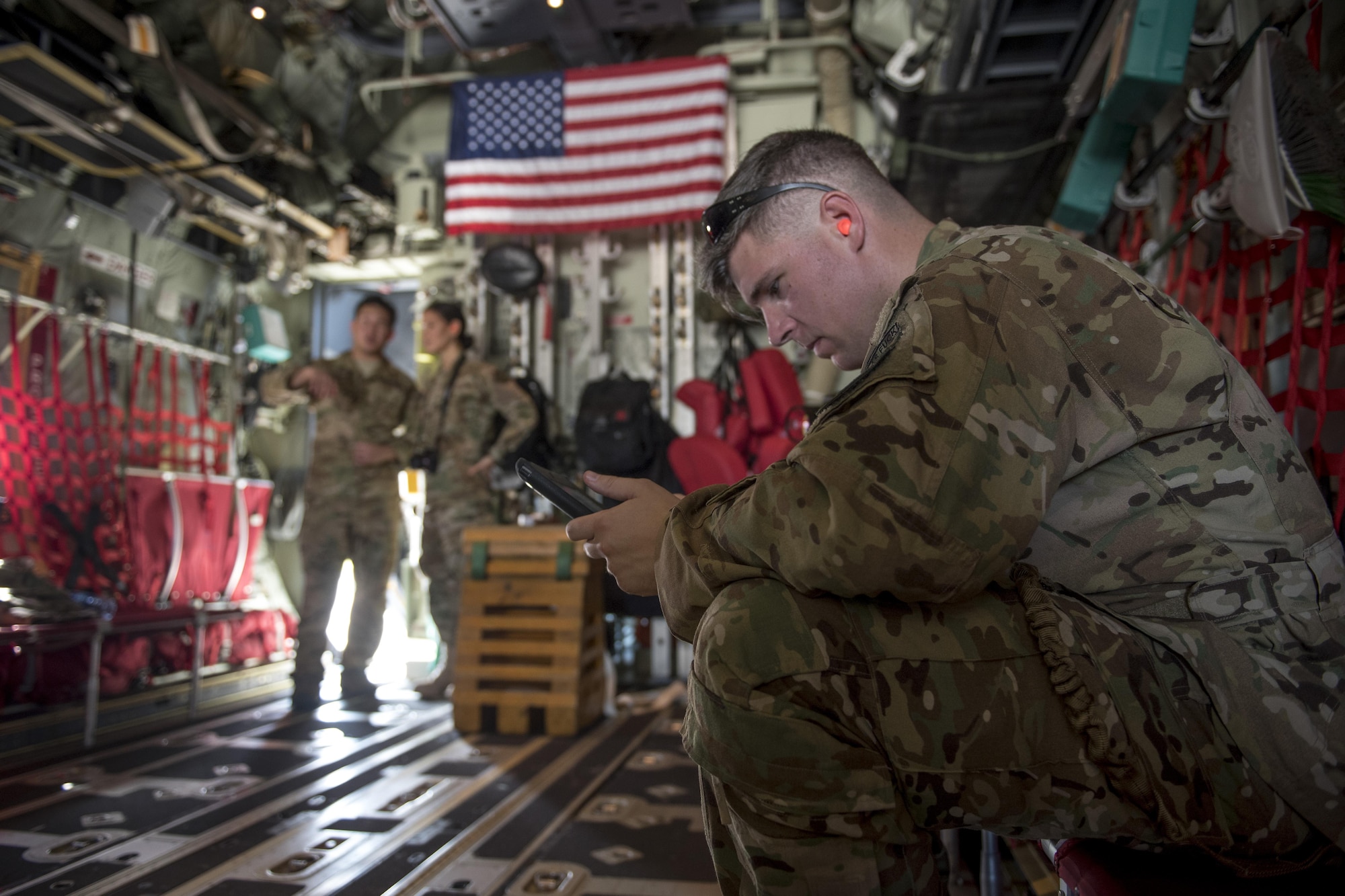 A U.S. Air Force MC-130J Commando II loadmaster assigned to the 17th Special Operations Squadron reviews a preflight checklist as part of a mass launch training mission June 22, 2017, at Kadena Air Base, Japan. The MC-130J was among four others that flew in formation and completed airdrop training on Ie Shima Range, Okinawa. (U.S. Air Force photo by Senior Airman John Linzmeier)