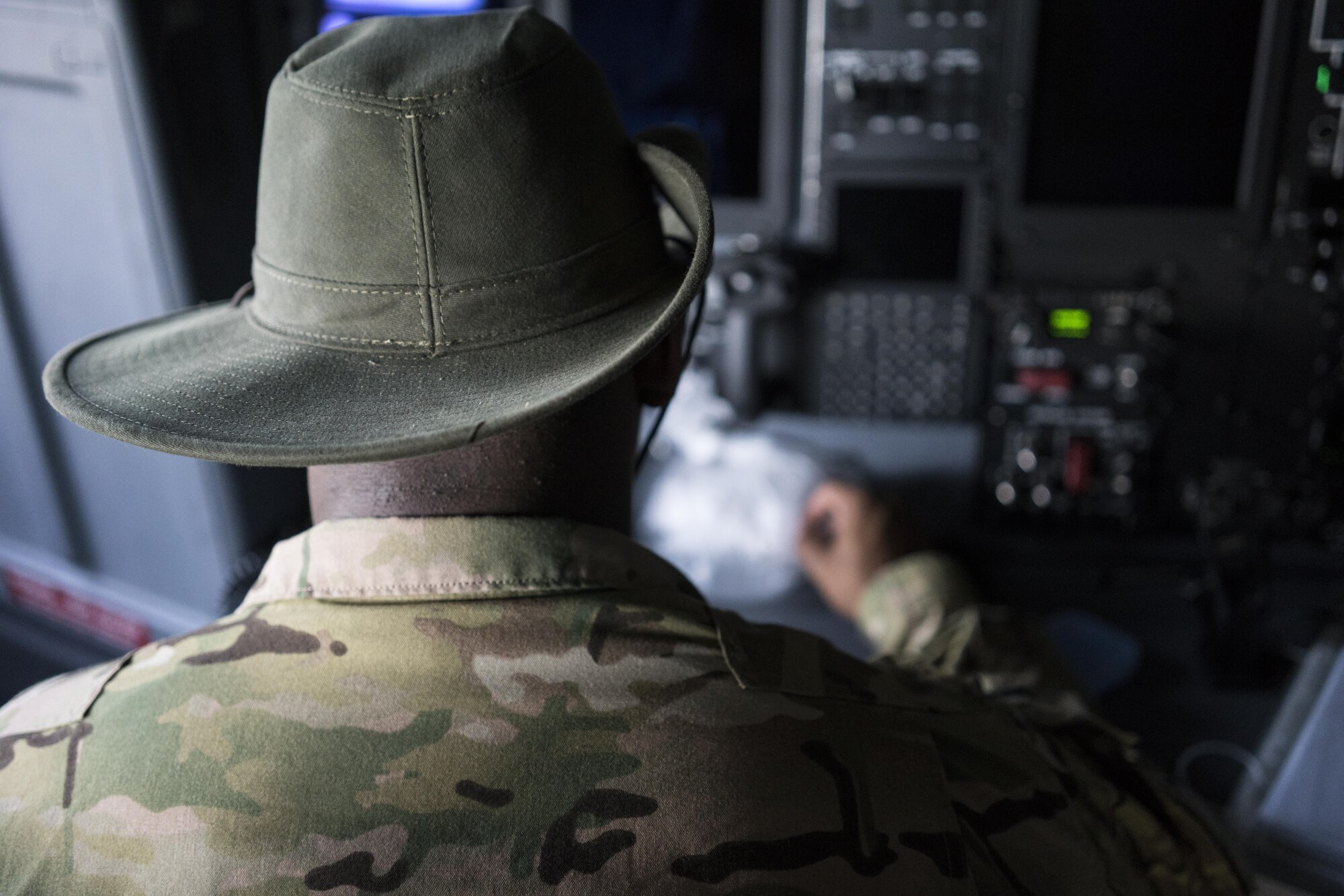 A U.S. Air Force MC-130J Commando II combat systems officer assigned to the 17th Special Operations Squadron prepares the Commando II for a mass launch training mission June 22, 2017, at Kadena Air Base, Japan. This is the third iteration of the annual training, which is referred to as ‘The Day of the JAKAL.’ It entailed a series of airdrops at Ie Shima Range, Okinawa, Japan, to hone in low-altitude maneuvers and supply-delivery capabilities. (U.S. Air Force photo by Capt. Jessica Tait)