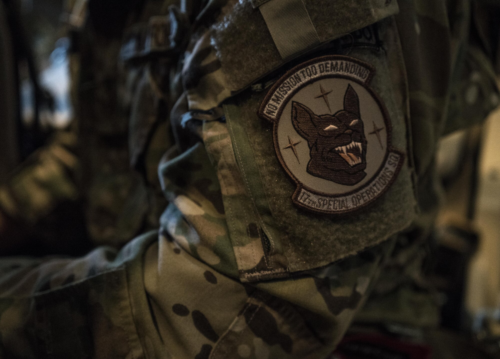 A U.S. Air Force MC-130J Commando II loadmaster assigned to the 17th Special Operations Squadron sits in the back of a Commando II during a mass launch training mission June 22, 2017, off the coast of Okinawa, Japan. The 17th SOS proudly exemplifies their motto, ‘no mission too demanding’ in both training and real-world contingencies. (U.S. Air Force photo by Capt. Jessica Tait)