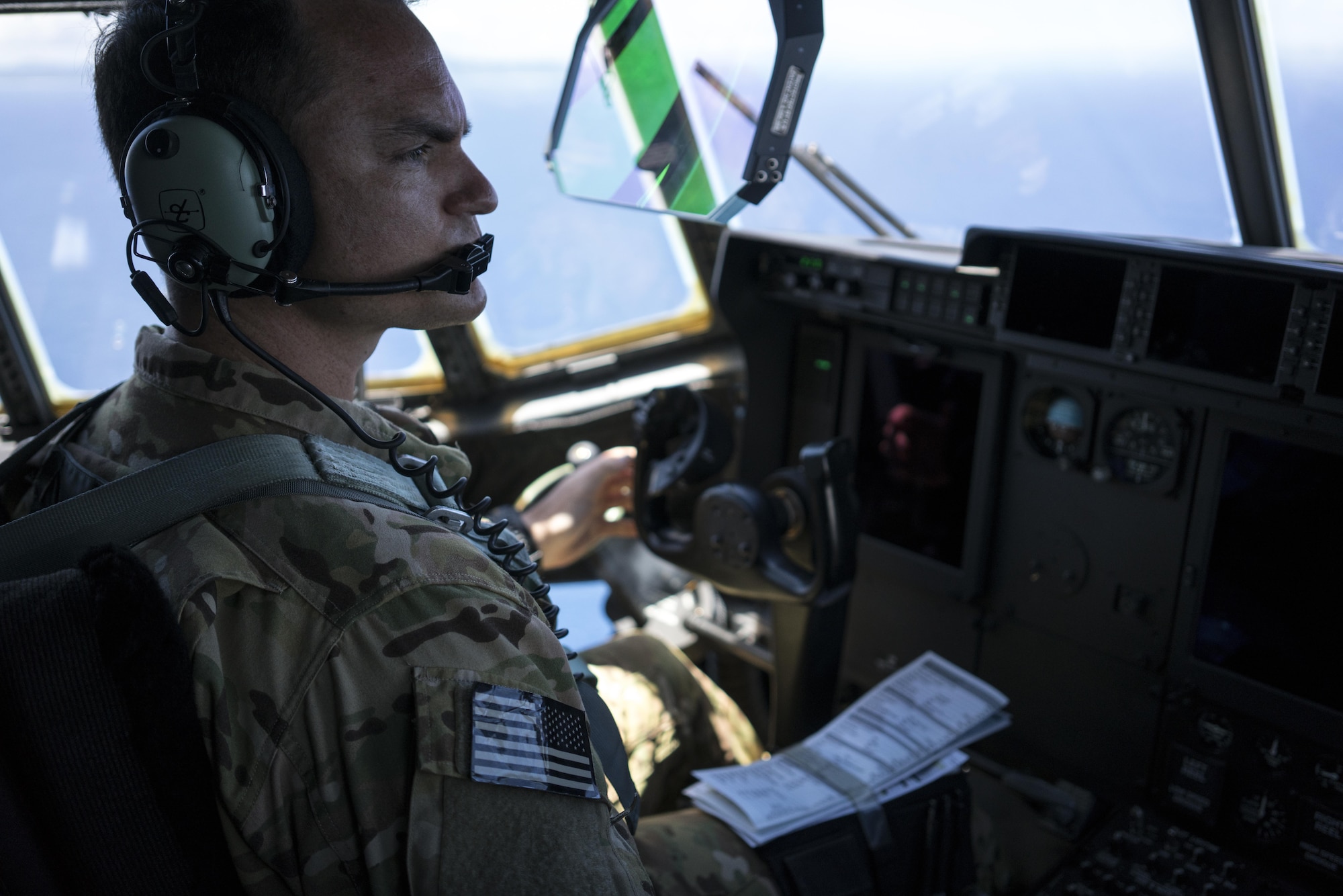 A U.S. Air Force MC-130J Commando II pilot assigned to the 17th Special Operations Squadron flies the Commando II during a mass launch training mission June 22, 2017, off the coast of Okinawa, Japan. Airmen from the 17th SOS conduct training operations often to ensure they are always ready perform a variety of high-priority, low-visibility missions throughout the Indo-Asia-Pacific-Region. (U.S. Air Force photo by Capt. Jessica Tait)