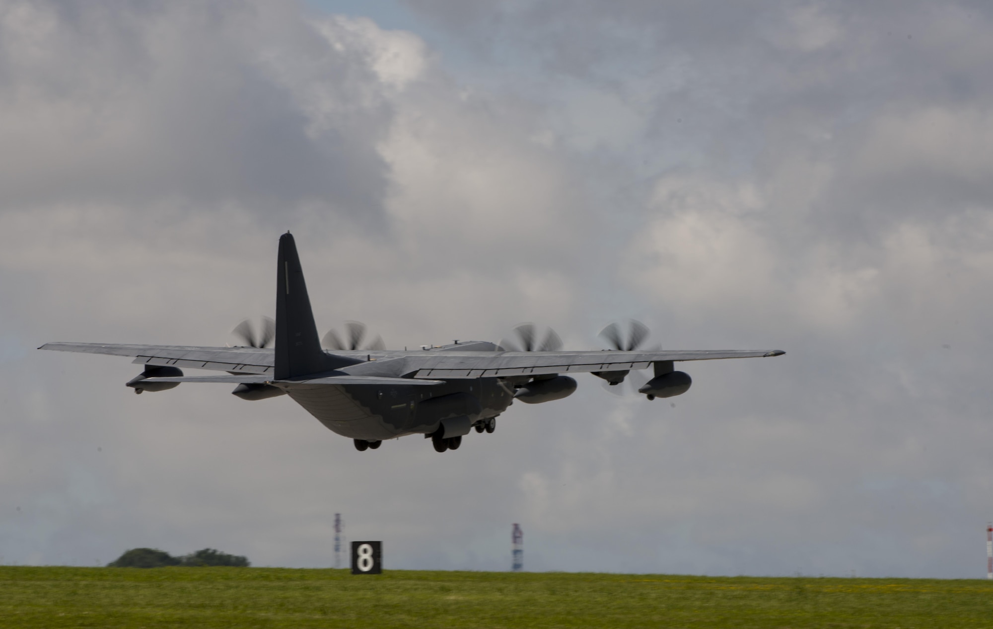 A U.S. Air Force MC-130J Commando II from the 17th Special Operations Squadron takes off from the runway during a mass launch training mission June 22, 2017 at Kadena Air Base, Japan. Airmen from the 17th SOS conduct training operations often to ensure constant readiness to perform a variety of high-priority, low-visibility missions throughout the Indo-Asia Pacific Region. (U.S. Air Force photo by Senior Airman Omari Bernard)