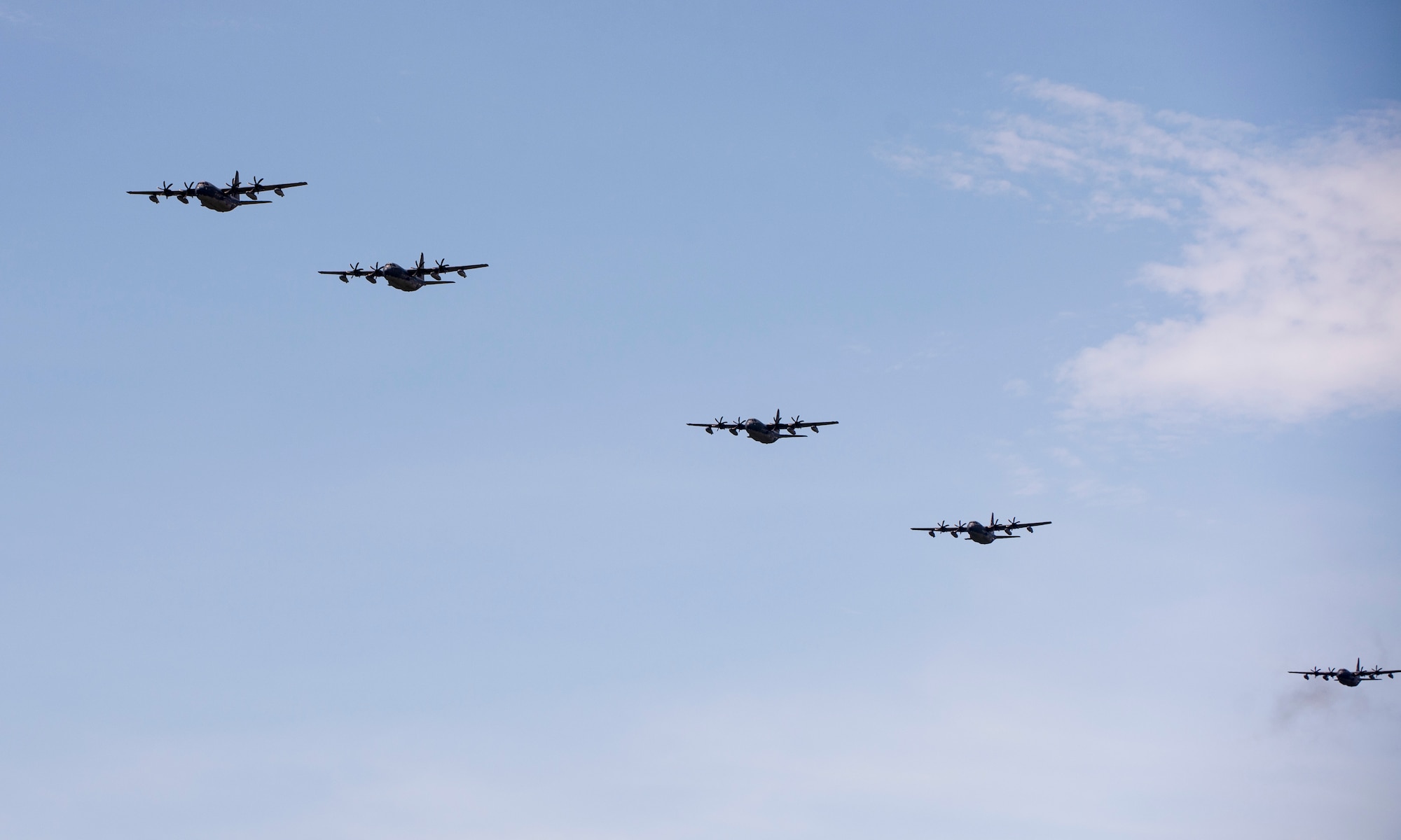 U.S. Air Force MC-130J Commando IIs from the 17th Special Operations Squadron return to base in a five-aircraft formation during a mass launch training mission June 22, 2017 at Kadena Air Base, Japan. Routine flights and airdrops are conducted to maintain proficiency and training certifications for prospective missions. (U.S. Air Force photo by Senior Airman Omari Bernard)