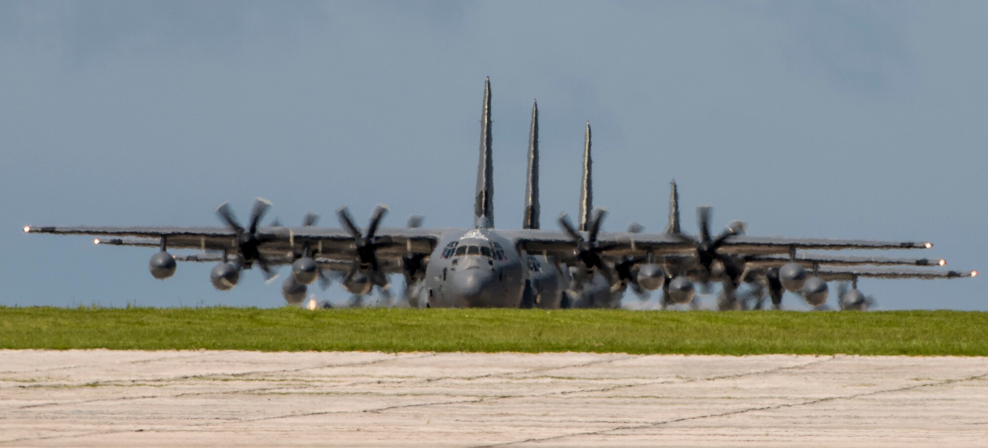 U.S. Air Force MC-130J Commando IIs from the 17th Special Operations Squadron taxi on the flight line in a four-aircraft formation during a mass launch training mission June 22, 2017 at Kadena Air Base, Japan. Commando IIs are capable of delivering supply drops over long distances and at short notice in order to support special operations forces, combat contingencies, or humanitarian aid to those in need. (U.S. Air Force photo by Senior Airman Omari Bernard)