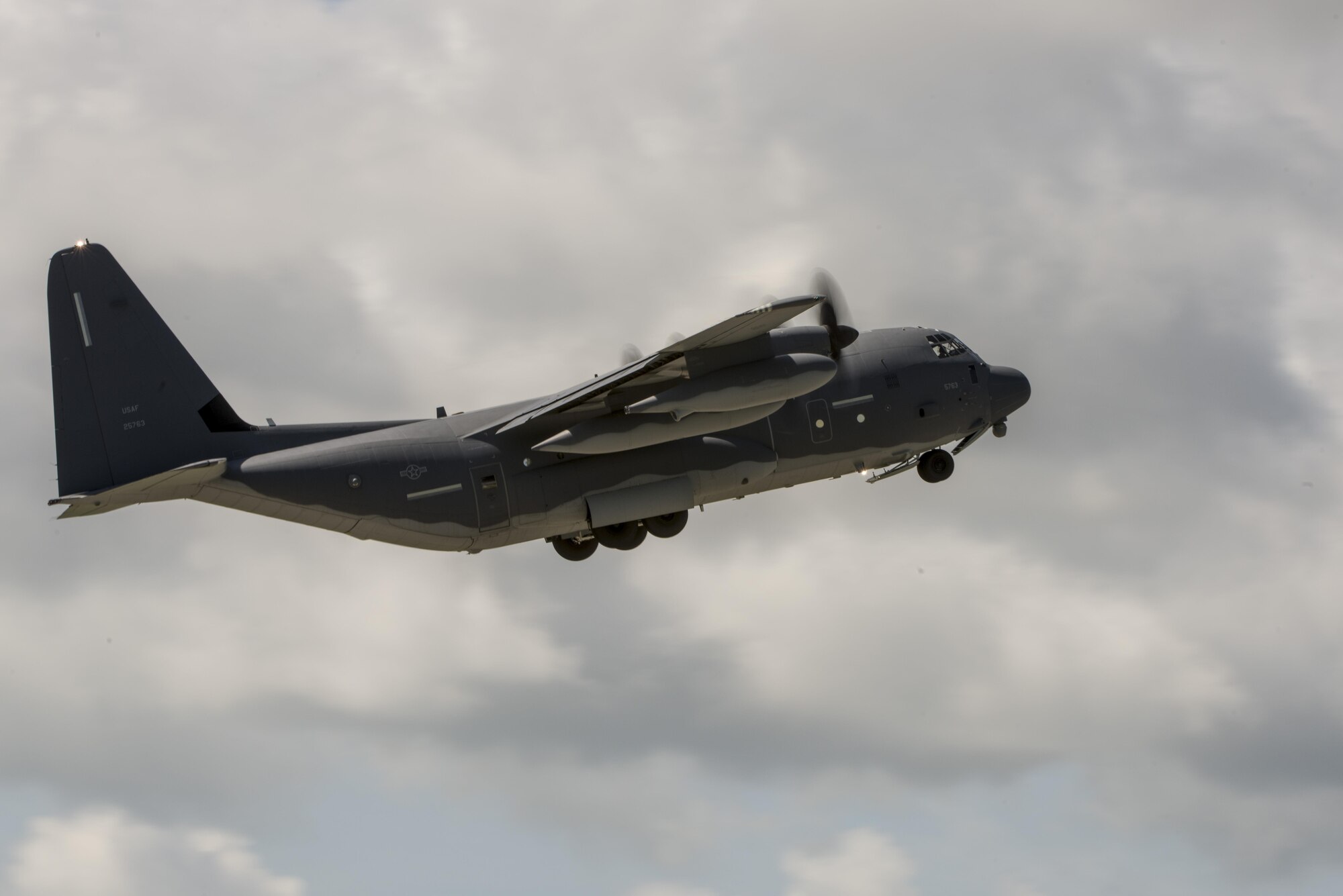 A U.S. Air Force MC-130J Commando II from the 17th Special Operations Squadron takes off from the runway during a mass launch training mission June 22, 2017 at Kadena Air Base, Japan. Airmen from the 17th SOS conduct training operations often to ensure constant readiness to perform a variety of high-priority, low-visibility missions throughout the Indo-Asia Pacific Region. (U.S. Air Force photo by Senior Airman Omari Bernard)