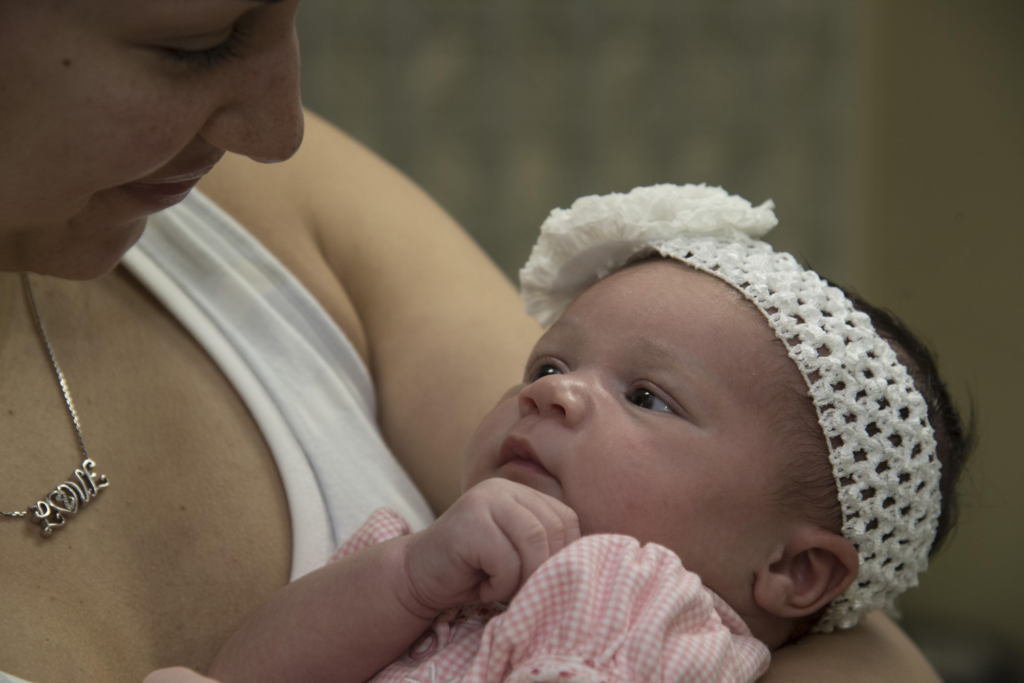 U.S. Air Force Airman 1st Class Monet Murdock, left, a 35th Logistics Readiness Squadron customer service technician and her daughter Aaliyah Murdock, right, stare into each other’s eyes at the 35th Medical Group women’s health clinic at Misawa Air Base, Japan, June 29, 2017. During the cycles of pregnancy, obstetrics and gynecologist physicians ensure a mother and their child are healthy throughout the entire process, ultimately helping the mother give birth at the end. (U.S. Air Force photo by Airman 1st Class Sadie Colbert)