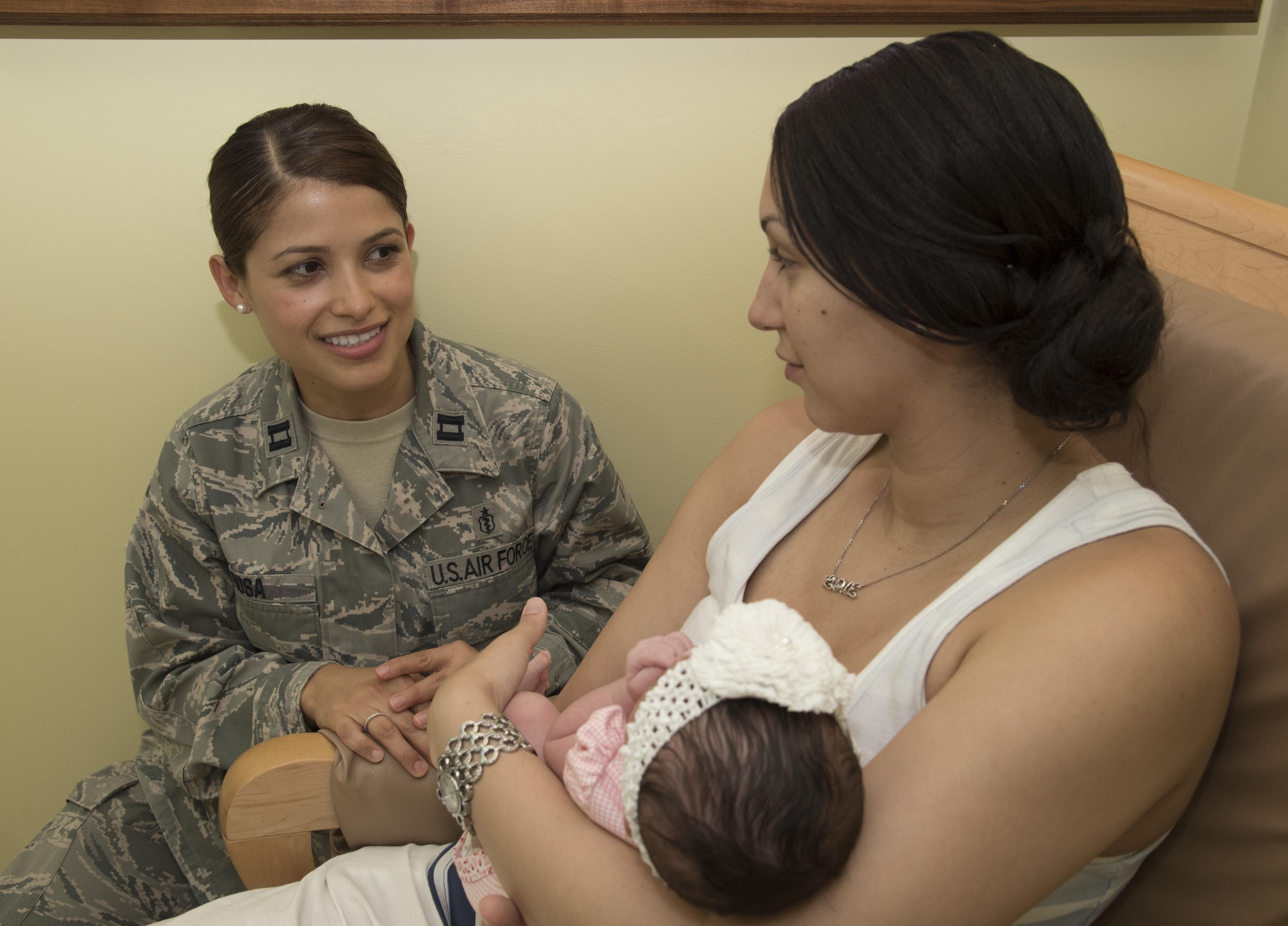 U.S. Air Force Capt. Paola Rosa, left, a 35th Surgical Operations Squadron obstetrics and gynecologist physician, talks with Airman 1st Class Monet Murdock, right, a 35th Logistics Readiness Squadron customer service technician, and her daughter Aaliyah Murdock, center, about her delivery at Misawa Air Base, Japan, June 29, 2017. Along with deliveries, the OB/GYN physicians assist with women’s overall health and bodily changes. (U.S. Air Force photo by Airman 1st Class Sadie Colbert)