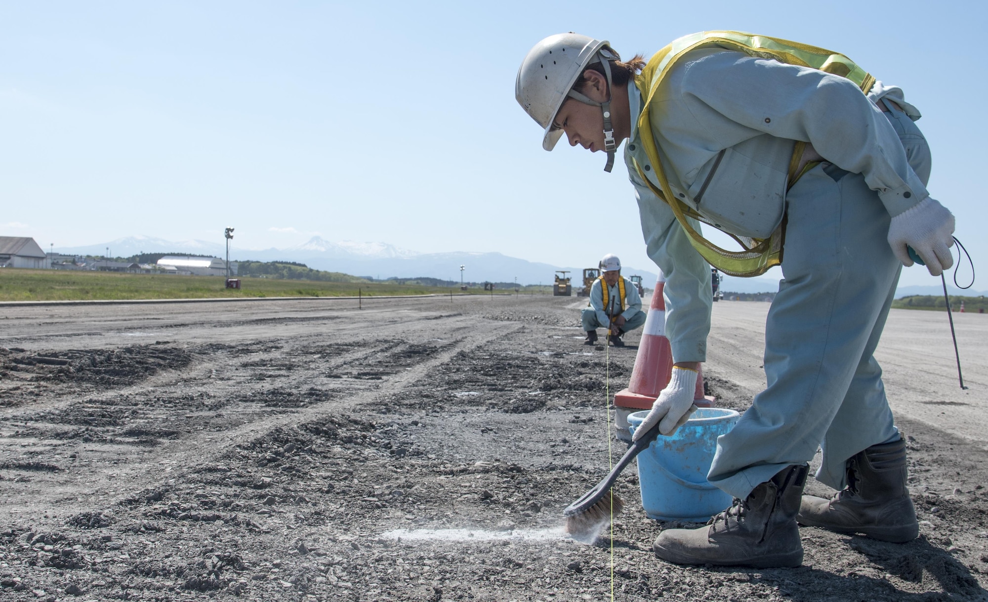 Japanese contractors conduct routine maintenance on the airfield at Misawa Air Base, Japan, May 18, 2017. The runway become fully operational June 26, more than a week ahead of schedule. The construction repaired degrading asphalt, spanning 1,463 meters, solidifying the 35th Fighter Wing to continue projecting power within the Indo-Asia-Pacific region and supporting its allies. (U.S. Air Force photo by Staff Sgt. Melanie Hutto)