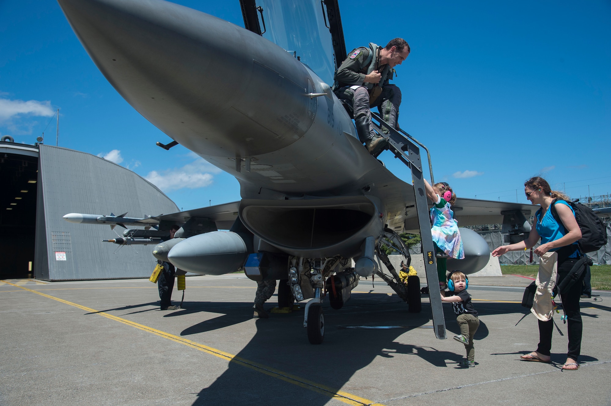 U.S. Air Force Lt. Col. Doyle Pompa, the 35th Operations Groups vice commander, meets with his family after returning home from a temporary duty location at Misawa Air Base, Japan, June 26, 2017. The 13th Fighter Squadron and 35th Maintenance Group personnel trained with Airmen from Kunsan Air Base, Republic of Korea, while the flight line underwent routine maintenance. During their tenure at Kunsan, 35th Fighter Wing pilots enhanced readiness capabilities while training in unfamiliar territories with our allies within the Pacific Air Forces region. (U.S. Air Force photo by Senior Airman Deana Heitzman)