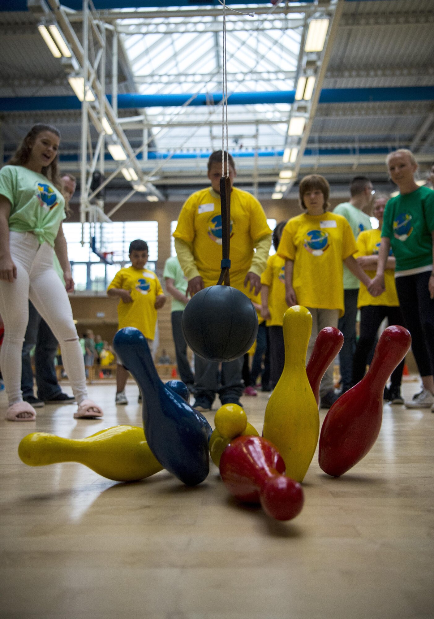 Marcel Dohring, student from Bitburg, knocks down bowling pins during the St. Martin Special Children's Day at Spangdahlem Air Base, Germany, June 28, 2017. Children from the event participated in a variety of activities including basketball throw, hula-hooping, balance beam and bowling. (U.S. Air Force photo by Senior Airman Preston Cherry)