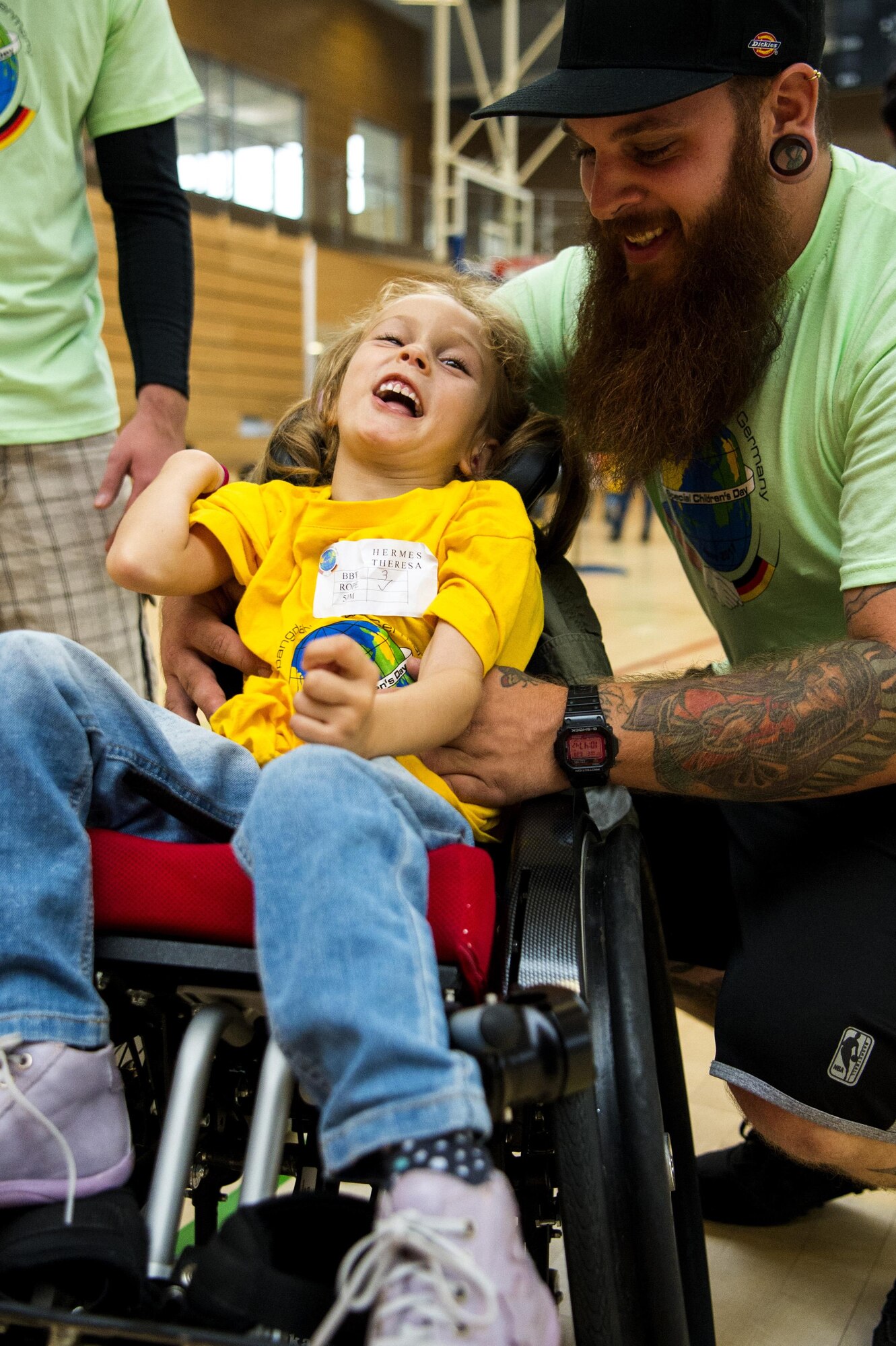Theresa Hermes, left, Bitburg student, laughs with Mirius Zender, right, event volunteer, during the St. Martins Special Children's Day at Spangdahlem Air Base, Germany, June 28, 2017. The event marked the 25th year where students with special needs around the area were invited to participate in activities with volunteers. (U.S. Air Force photo by Senior Airman Preston Cherry)