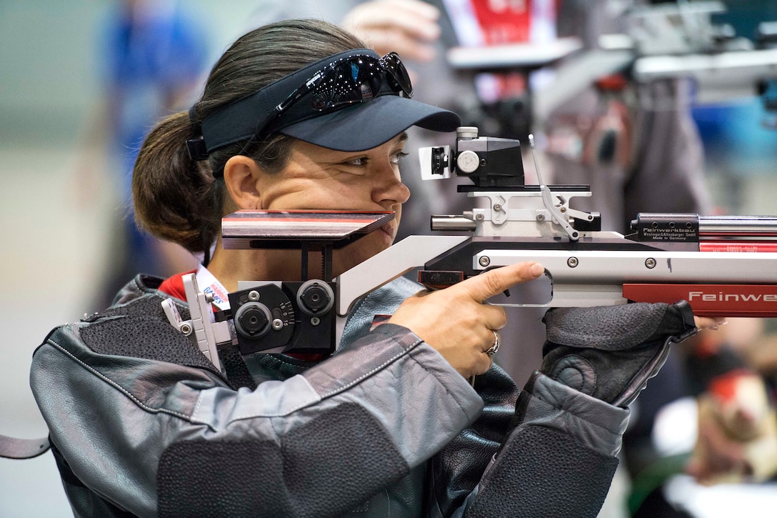 Marine Corps Staff Sgt. Patricia Reynolds aims an air rifle during shooting practice for the 2017 Department of Defense Warrior Games in Chicago, June 29, 2017. DoD photo by EJ Hersom 