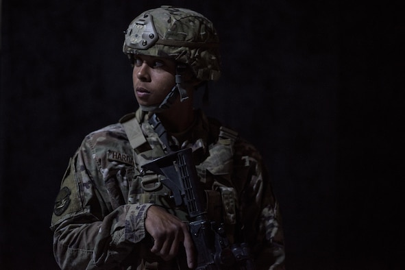A member of the 332nd Expeditionary Security Forces Squadron looks over his shoulder while guarding an entrance point during an active-shooter exercise June 8, 2017, in Southwest Asia. The purpose of the exercise was to evaluate the squadron’s ability to respond to an emergency and improve tactics in a simulated environment. (U.S. Air Force photo/Senior Airman Damon Kasberg)
