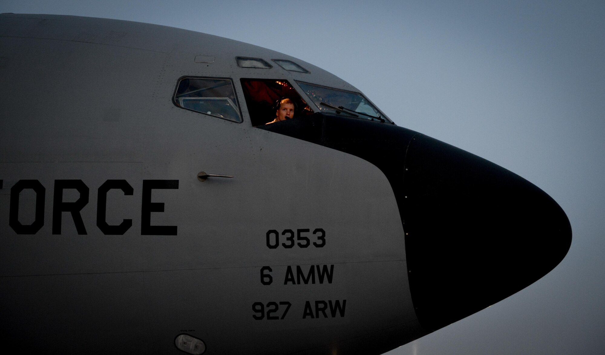 A KC-135 Stratotanker pilot, assigned to the 340th Expeditionary Air Refueling Squadron, looks out an aircraft window before a flight in support of Operation Inherent Resolve at Al Udeid Air Base, Qatar, June 26, 2017. The KC-135 provides aerial refueling capabilities to U.S. and coalition forces working to liberate territory and people under the control of the Islamic State of Iraq and Syria. (U.S. Air Force photo/Staff Sgt. Michael Battles)