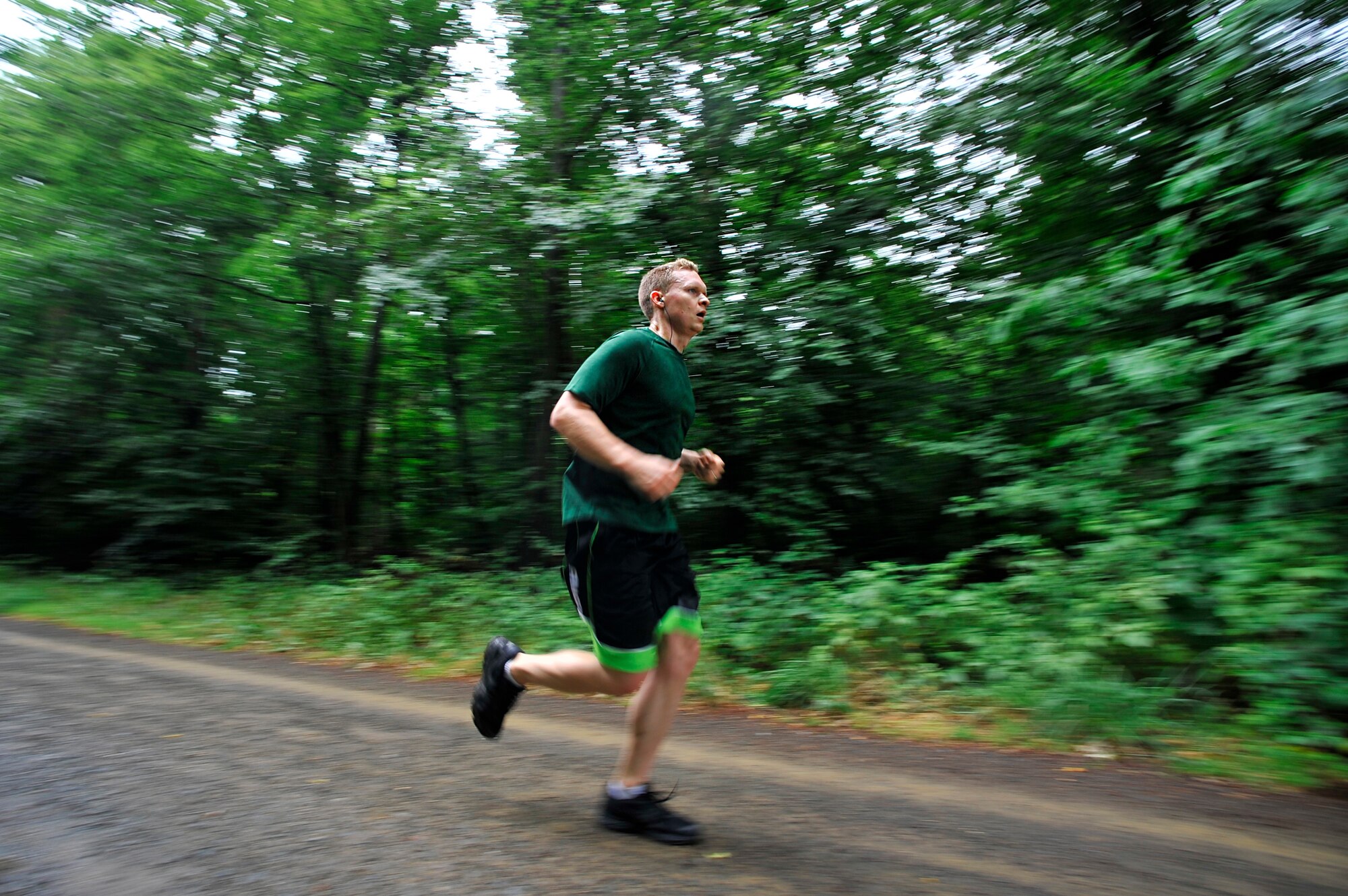U.S. Air Force Capt. Joshua Bergman, 435th Air Ground Operations Wing executive officer, paces himself as he runs the 3rd annual 435th AGOW 10-miler outside the 435th Construction and Training Squadron on Ramstein Air Base, Germany, June 28, 2017. The purpose of the event was to boost esprit de corps throughout the wing. (U.S. Air Force photo by Airman 1st Class D. Blake Browning)