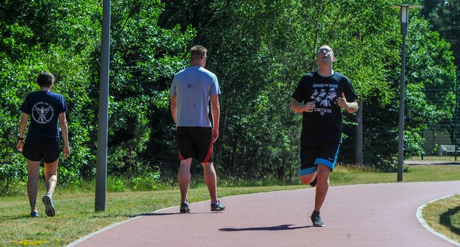 U.S. Air Force Airman 1st Class Cody Hammond, 86th Operations Support Squadron intelligence analyst, finishes a 200-meter progressive sprint during a Running Improvement Program workout on Ramstein Air Base, Germany, June 26, 2017. The program uses progressive increases not only in workouts but in the overall program, as workouts gradually increase the distance runners have to complete. (U.S. Air Force photo by Staff Sgt. Timothy Moore)