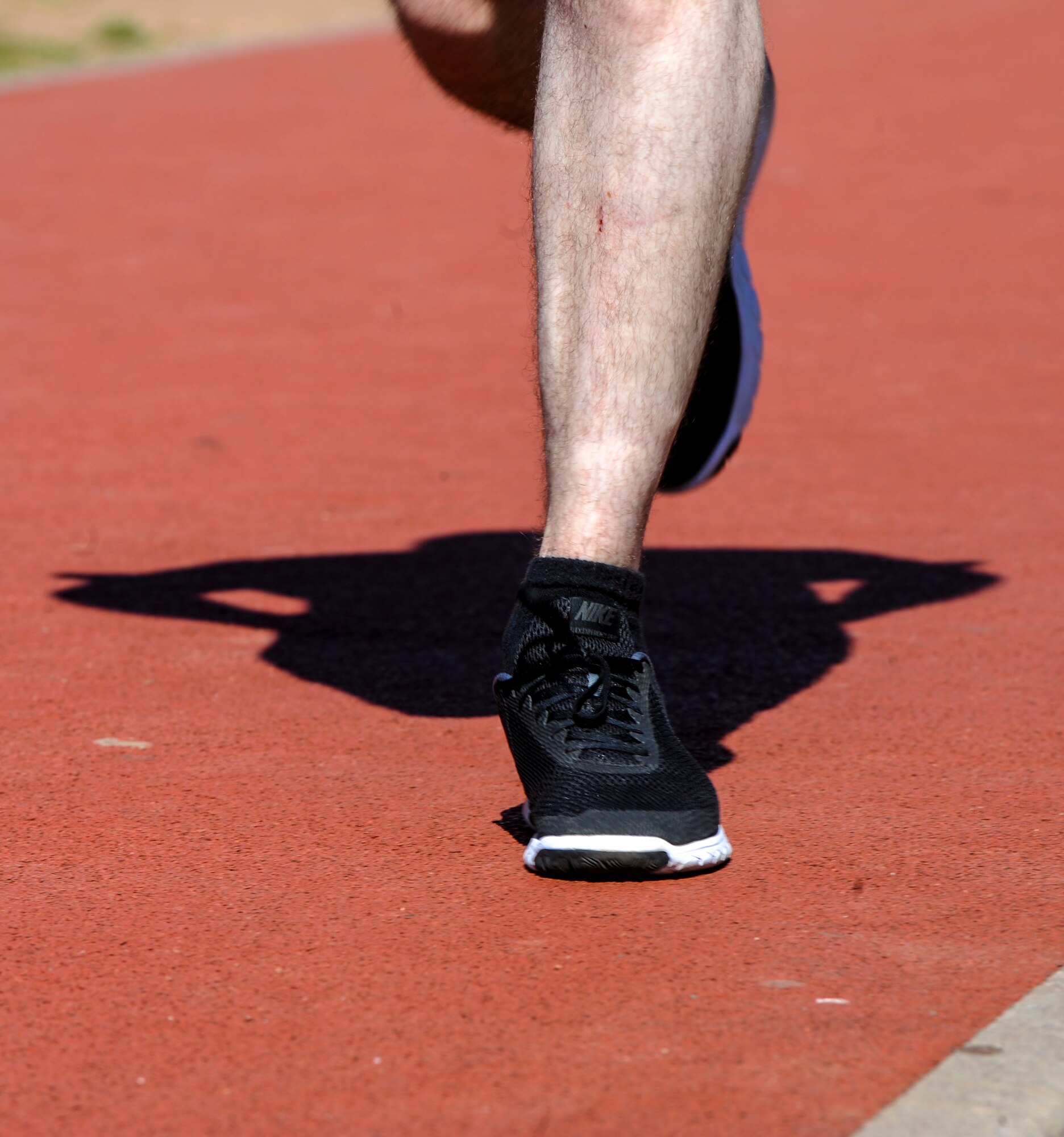 U.S. Air Force Airman 1st Class Cody Hammond, 86th Operations Support Squadron intelligence analyst, runs a 400-meter progressive sprint during a Running Improvement Program workout on Ramstein Air Base, Germany, June 26, 2017. The progressive sprint requires runners to gradually increase their speed as they run, topping out at near 80 percent of their max speed. While the speed aspect of the workout is important, the program coaches encouraged members to focus more on running form than speed. (U.S. Air Force photo by Staff Sgt. Timothy Moore)