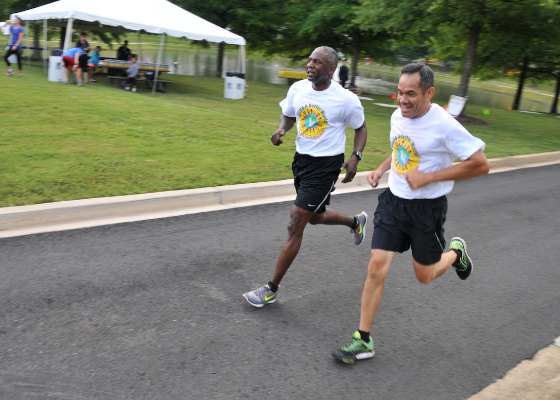 DLA Director Army Lt. Gen. Darrell Williams (left) and Army Command Sgt. Maj. Charles Tobin run in the Family Day Fun Run.