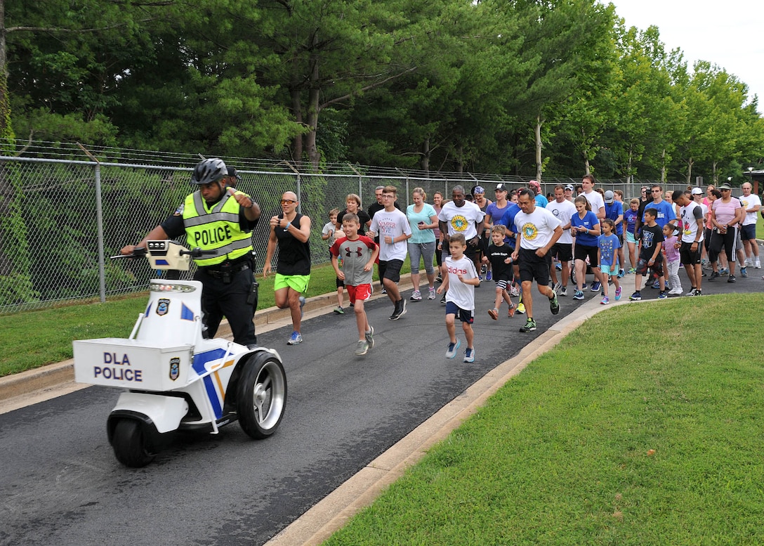 Employees and family members join in the annual Family Day Fun Run June 27, 2017.