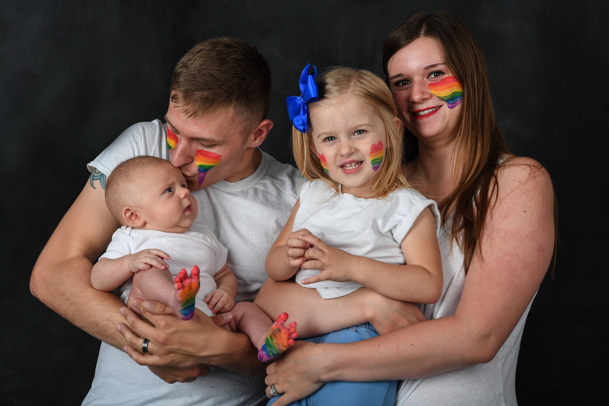 “There is nothing more human than loving someone who is also human. We just so happened to fall in love with each other.” – U.S. Air Force Senior Airman Devin Boyer, 86th Airlift Wing Public Affairs photojournalist with his wife, Blakely and their two children Annabel and Ronan. 