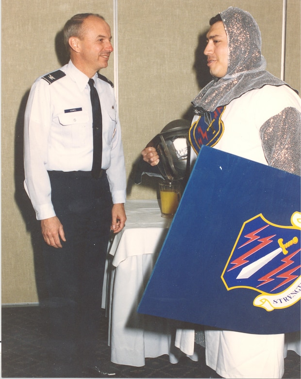 PETERSON AIR FORCE BASE, Colo. – Col. Michael Hamel, 21st Space Wing vice commander, stands with Staff Sgt. Ray “Razor” Duron (right) who played Iron Mike in the 1996 Guardian Challenge.  Duron is in the first mascot costume and was the first wing member to portray Iron Mike. (Courtesy photo)