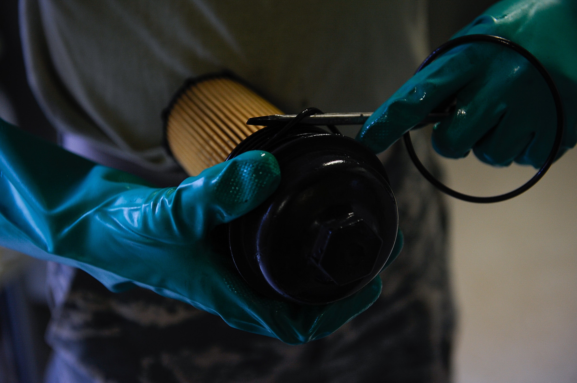 Airman 1st Class William Woodside, 786th Civil Engineer Squadron electrical power production apprentice, preps an oil filter for installation on Ramstein Air Base, Germany, June 27, 2017. Annual maintenance such as oil and fuel filter changes and coolant changes every 36 months are required to ensure the generator stays operational. (U.S. Air Force photo by Airman 1st Class Savannah L. Waters)