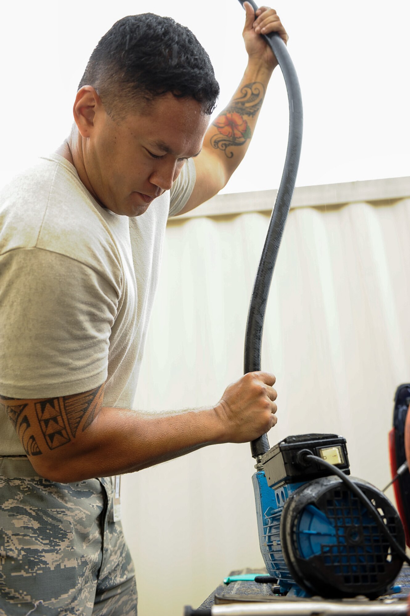 Staff Sgt. Justin Tayamen, 786th Civil Engineer Squadron electrical power production craftsman, preps a pump to put fresh coolant in a generator on Ramstein Air Base, Germany, June 27, 2017. The generator system provides automated back-up electrical power to Ramstein’s most critical facilities. (U.S. Air Force photo by Airman 1st Class Savannah L. Waters)
