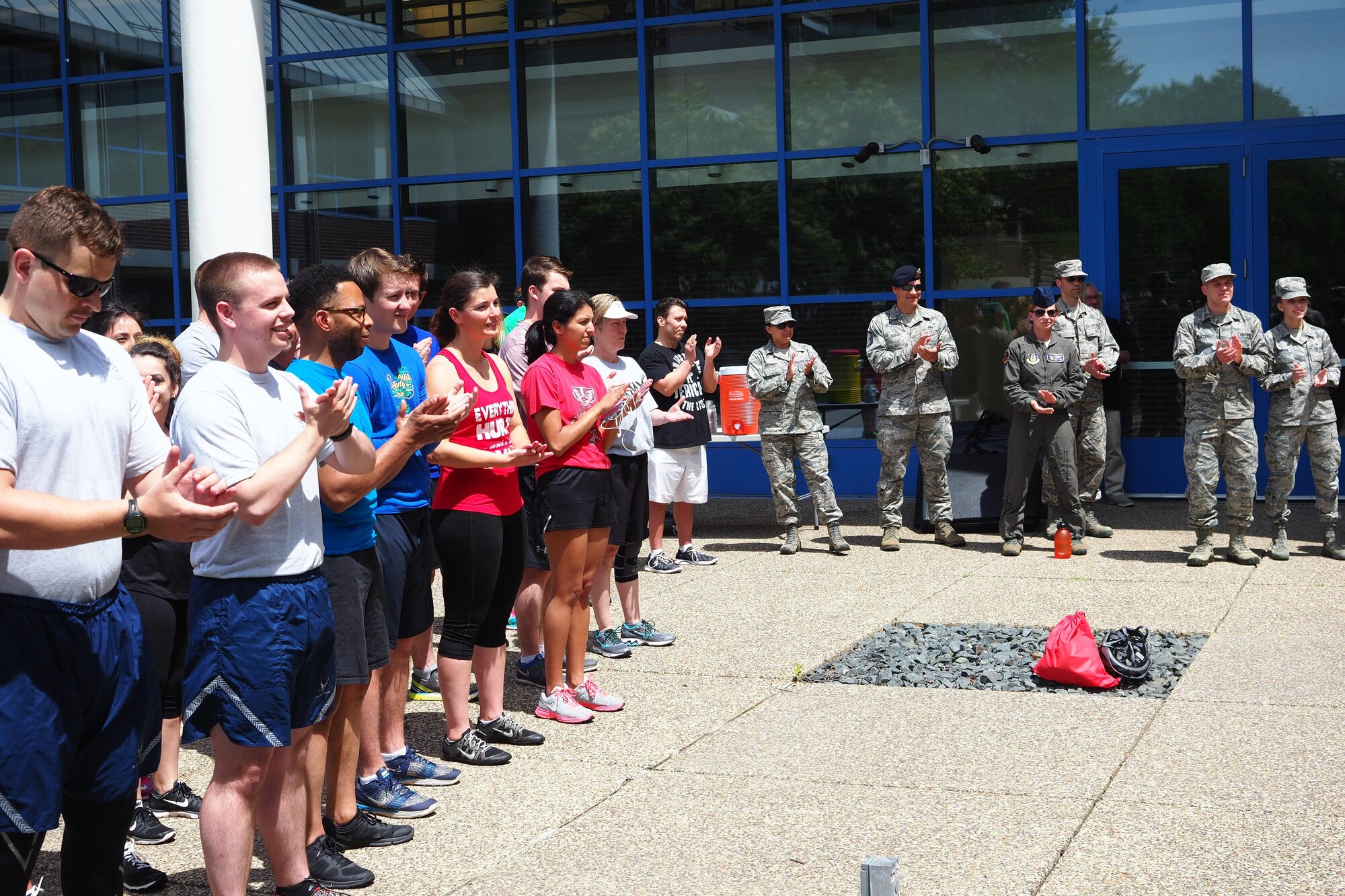 Ecolab employees and 934th Airlift Wing members are briefed before the fitness challenge begins. (Air Force Photo/Paul Zadach)