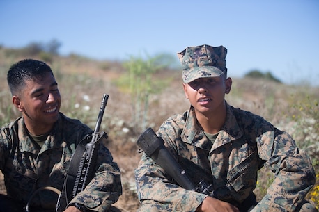 U.S. Marine Lance Cpls. Luis Orozohernandez and Lance Cpl. Luis Mejia, motor transportation operators for Combat Logistics Battalion 5, Headquarters Regiment, 1st Marine Logistics Group take a break during a seven mile conditioning hike on Camp Pendleton, Calif., June 27, 2017. The Marines have multiple conditioning hikes to prepare for Mountain Exercise 4-17 which will be conducted at the Marine Corps Mountain Warfare Training Center in Bridgeport, Calif. (U.S. Marine Corps photo by Lance Cpl. Timothy Shoemaker)