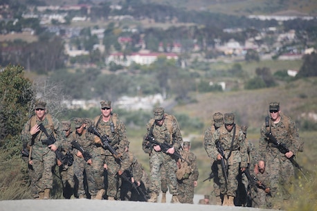 U.S. Marines and Sailors with Combat Logistics Battalion 5, Combat Logistics Regiment 1, 1st Marine Logistics Group participate in a seven mile conditioning hike on Camp Pendleton, Calif., June 27, 2017. The Marines have multiple conditioning hikes to prepare for Mountain Exercise 4-17 which will be conducted at the Marine Corps Mountain Warfare Training Center in Bridgeport, Calif. (U.S. Marine Corps photo by Lance Cpl. Timothy Shoemaker)