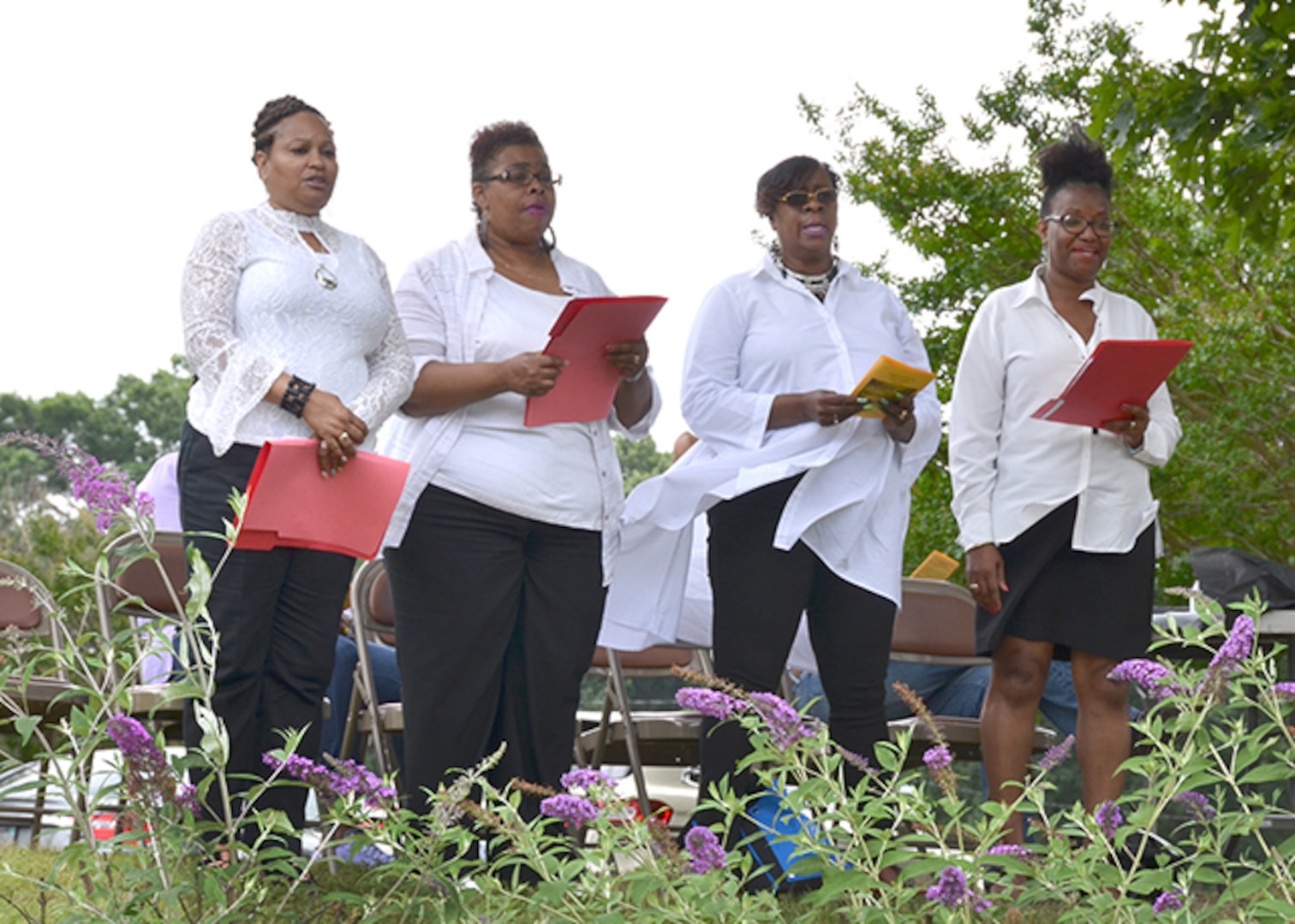 Defense Logistics Agency Aviation's Bellwood Choir members sang for attendees during the Juneteenth Observance ceremony on June 23, 2017 at the African-American gravesite on Defense Supply Center Richmond, Virginia. Choir members from left to right are: Phyllis Spearman, lead business readiness and compliance specialist, Business Process Support Directorate; Patricia Dandridge, contract specialist, Supplier Operations Commodities Directorate; Cynthia White, resolution specialist, and Margie Brooks, lead general supply specialist in Planning Process Directorate. 
