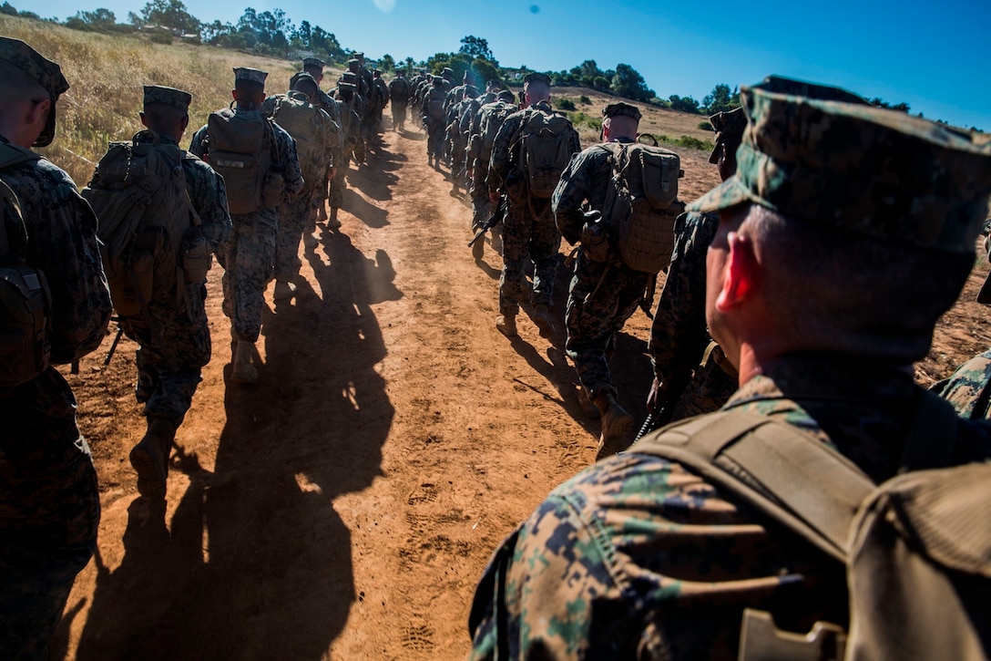 U.S. Marines and Sailors with Combat Logistics Battalion 5, Combat Logistics Regiment 1, 1st Marine Logistics Group participate in a seven mile conditioning hike on Camp Pendleton, Calif., June 27, 2017. The Marines have multiple conditioning hikes to prepare for Mountain Exercise 4-17 which will be conducted at the Marine Corps Mountain Warfare Training Center in Bridgeport, Calif. (U.S. Marine Corps photo by Lance Cpl. Adam Dublinske)