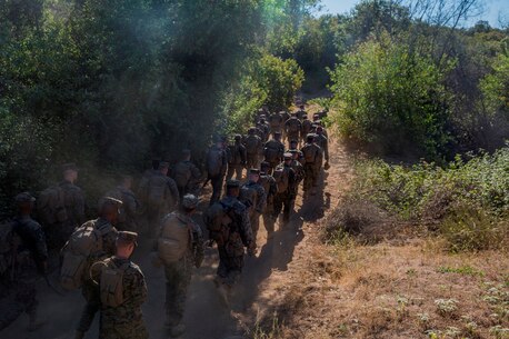 U.S. Marines and Sailors with Combat Logistics Battalion 5, Combat Logistics Regiment 1, 1st Marine Logistics Group participate in a seven mile conditioning hike on Camp Pendleton, Calif., June 27, 2017. The Marines have multiple conditioning hikes to prepare for Mountain Exercise 4-17 which will be conducted at the Marine Corps Mountain Warfare Training Center in Bridgeport, Calif. (U.S. Marine Corps photo by Lance Cpl. Adam Dublinske)