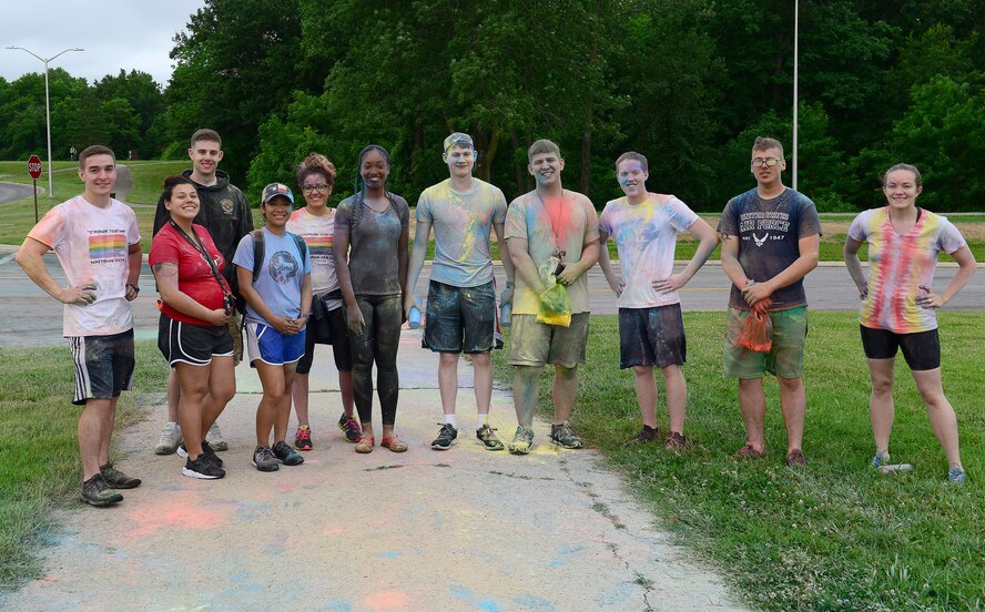 Members of Team Whiteman volunteer at the base’s monthly 5K run at Whiteman Air Force Base, Mo., June 23, 2017. The base hosts a monthly 5K run and this month's 5K was a color run in honor of Lesbian, Gay, Bisexual and Transgender pride month. This marks the second year that Whiteman has held a LGBT color run. (U.S. Air Force photo by Airman Taylor Phifer)